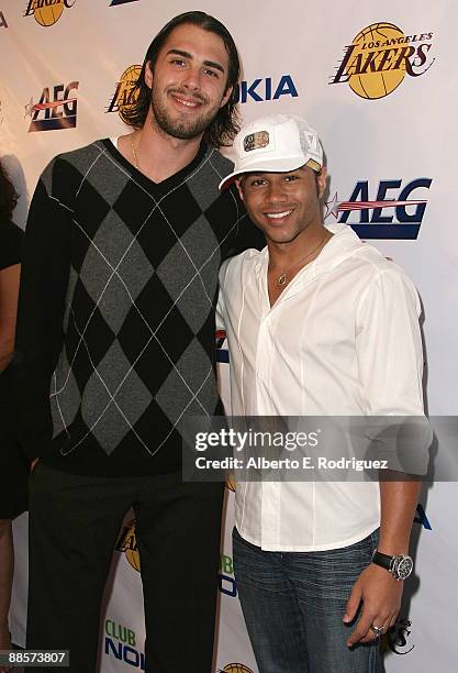 Player Sasha Vujacic and actor Corbin Bleu arrive at the Los Angeles Laker's official championship victory party at Club Nokia on June 18, 2009 in...