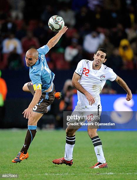 Fabio Cannavaro of Italy lunges for the ball with Mohamed Aboutrika of Egypt during the FIFA Confederations Cup, between Italy and Egypt at Ellis...