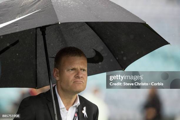 Josep Gombau of the Wanderers watches his team warm up under an umbrella during the round nine A-League match between the Western Sydney Wanderers...