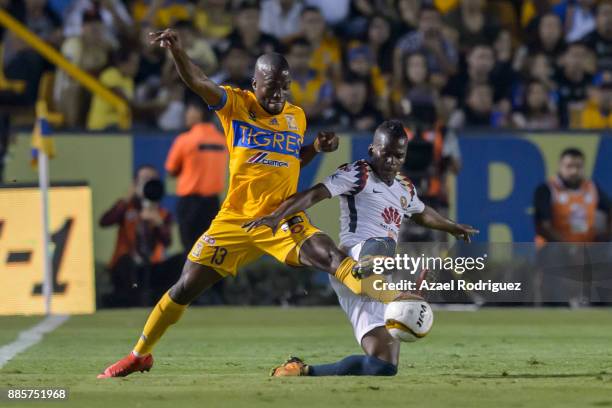 Enner Valencia of Tigres fights for the ball with Carlos Darwin Quintero of America during the semifinal second leg match between Tigres UANL and...