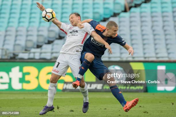 Brendon Santalab of the Wanderers is heavily challenged by Roar's Daniel Bowles, during the round nine A-League match between the Western Sydney...