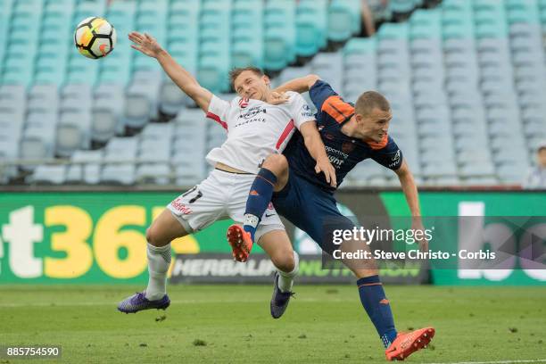Brendon Santalab of the Wanderers is heavily challenged by Roar's Daniel Bowles, during the round nine A-League match between the Western Sydney...