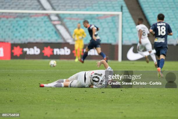 Alvaro Cejudo of the Wanderers lies on the ground after being heavily tackled during the round nine A-League match between the Western Sydney...