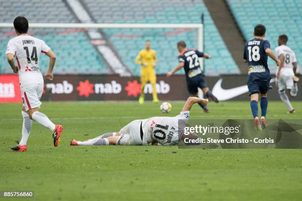 Alvaro Cejudo of the Wanderers lies on the ground after being heavily tackled during the round nine A-League match between the Western Sydney...