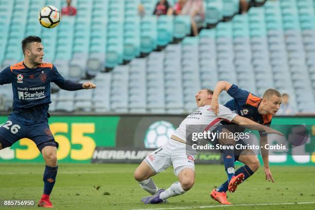 Brendon Santalab of the Wanderers is heavily challenged by Roar's Daniel Bowles, during the round nine A-League match between the Western Sydney...