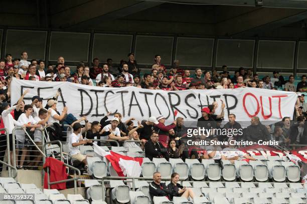 The RBB of the Wanderers hold up a sign stating "FFA Dictatorship Out" during the round nine A-League match between the Western Sydney Wanderers and...