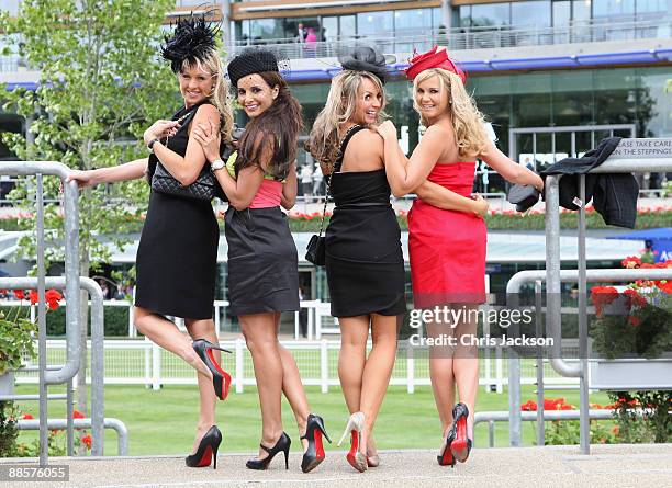 Girls with red soled high heeled shoes pose for a photograph on the second day of Royal Ascot 2009 at Ascot Racecourse on June 19, 2009 in Ascot,...