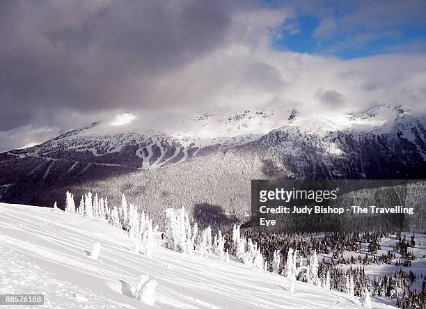 awesome light over blackcomb mountain - blackcomb mountain stock pictures, royalty-free photos & images