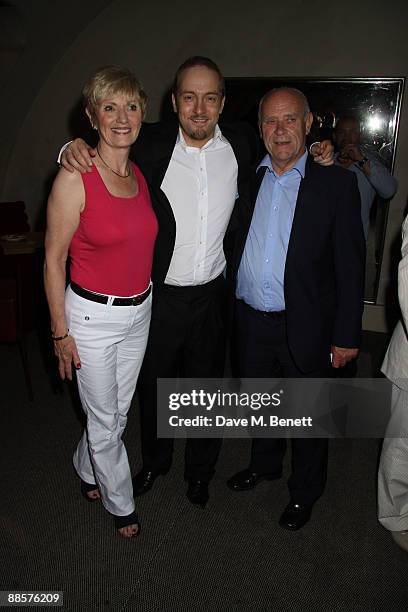 Derren Brown and his parents pose for photographs at his party at Adam Street Wine Bar on June 17, 2009.