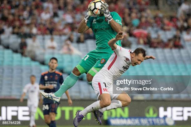 Brendon Santalab of the Wanderers is hurt in this challenge by Roar's goalkeeper Jamie Young during the round nine A-League match between the Western...