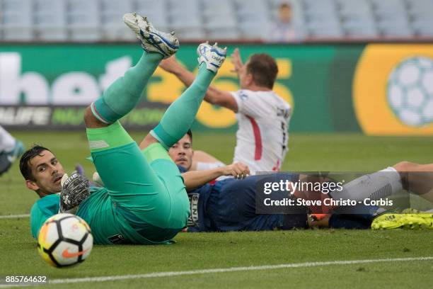 Jamie Young of the Roar watches the ball go out after a challenge by Wanderers Jaushua Sotirio, during the round nine A-League match between the...