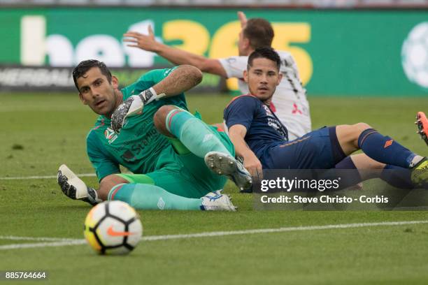 Jamie Young of the Roar watches the ball go out after a challenge by Wanderers Jaushua Sotirio, during the round nine A-League match between the...