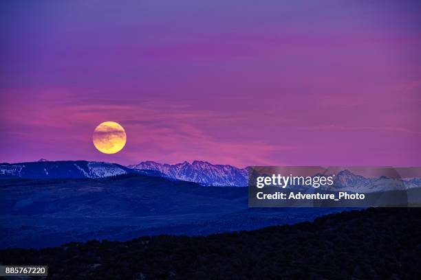 moonrise and scenic mountains at sunset eagle colorado - pink moon stock pictures, royalty-free photos & images