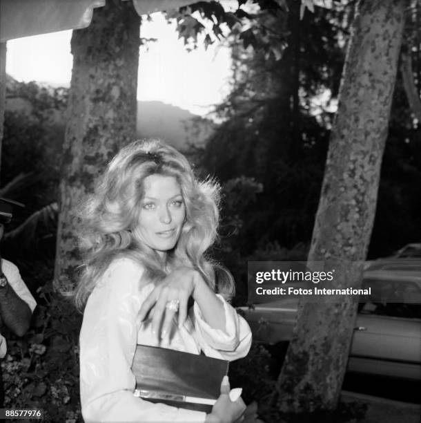 Just-married American actress Farrah Fawcett shows off her wedding ring at the reception following her marriage to Lee Majors at the Hotel Bel-Air,...