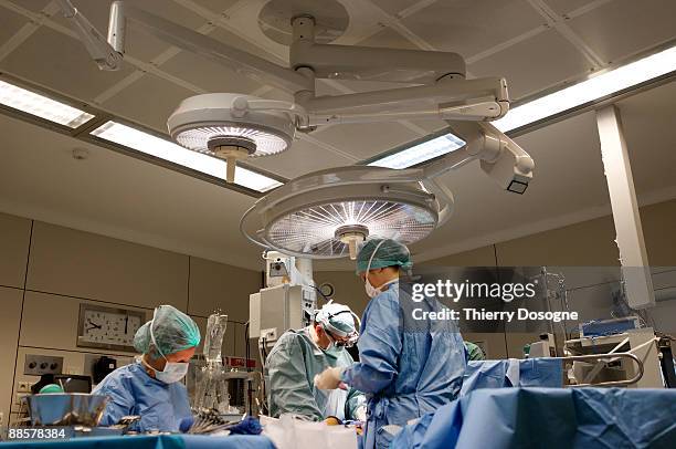 surgeons - operating table stock pictures, royalty-free photos & images