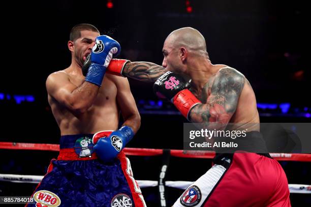 Miguel Cotto lands a punch against Sadaam Ali during their Junior Middleweight bout at Madison Square Garden on December 02, 2017 in New York City.