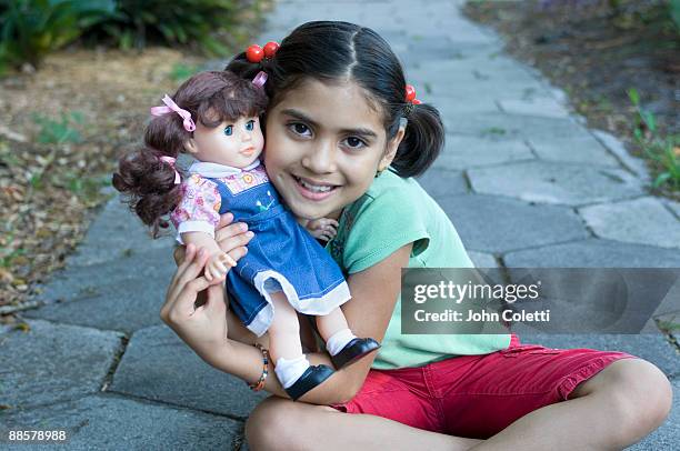 8 year old hispanic girl - american girl doll stock pictures, royalty-free photos & images