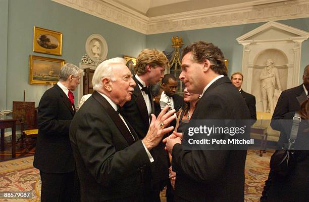 Walter Cronkite and Democratic National Committee Chairman Terry McAuliffe.