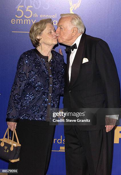 Legendary newscaster Walter Cronkite gives his wife Betsy a kiss as they pose for photographers after he presented the Bob Hope Humanitarian Award to...