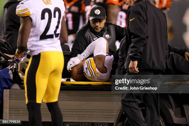 Ryan Shazier of the Pittsburgh Steelers reacts as he is carted off the field after a injury against the Cincinnati Bengals during the first half at...