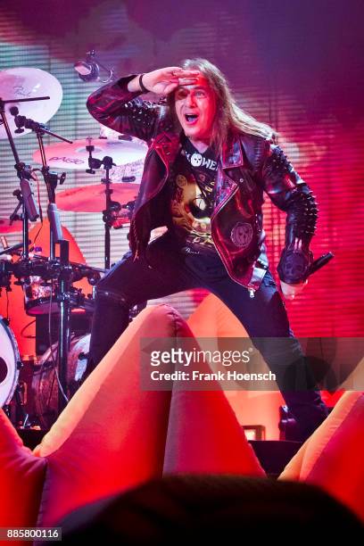 Singer Andi Deris of the German band Helloween performs live on stage during a concert at the Tempodrom on December 4, 2017 in Berlin, Germany.