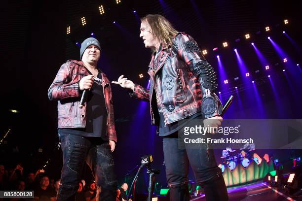 Michael Kiske and Andi Deris of the German band Helloween perform live on stage during a concert at the Tempodrom on December 4, 2017 in Berlin,...