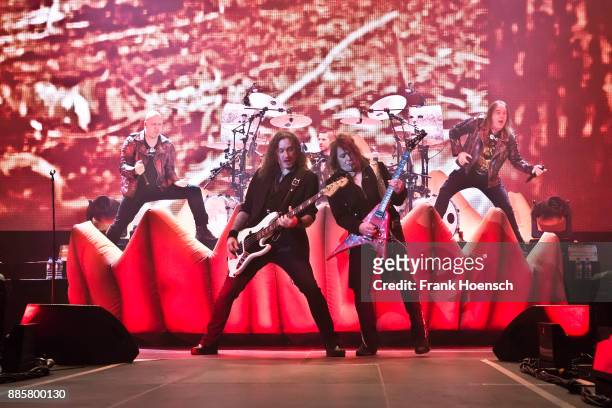 Michael Kiske, Markus Grosskopf, Daniel Loeble, Sascha Gerstner and Andi Deris of the German band Helloween perform live on stage during a concert at...