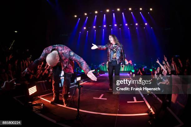 Michael Kiske and Andi Deris of the German band Helloween perform live on stage during a concert at the Tempodrom on December 4, 2017 in Berlin,...