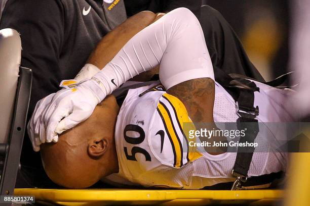 Ryan Shazier of the Pittsburgh Steelers reacts as he is carted off the field after a injury against the Cincinnati Bengals during the first half at...