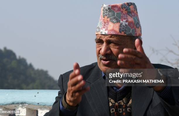 This photo taken on November 29, 2017 shows Nepali astrologer Angiras Neupane talking in an interview with AFP at his residence in Duwakot. Nepal's...