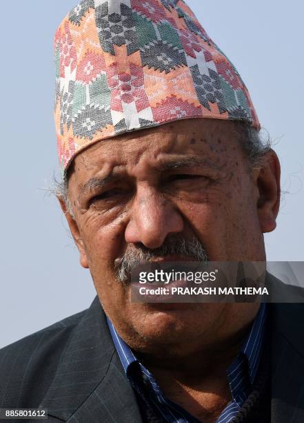 This photo taken on November 29, 2017 shows Nepali astrologer Angiras Neupane talking in an interview with AFP at his residence in Duwakot. Nepal's...