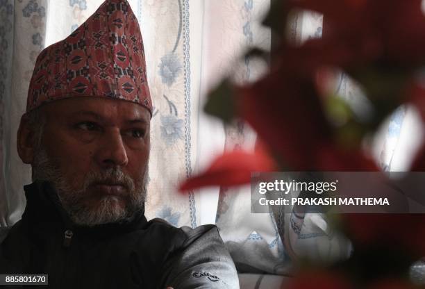 This photograph taken on November 22, 2017 shows Nepali astrologer Ojraj Lohani during an interview with AFP in Kathmandu. Nepal's prime minister is...
