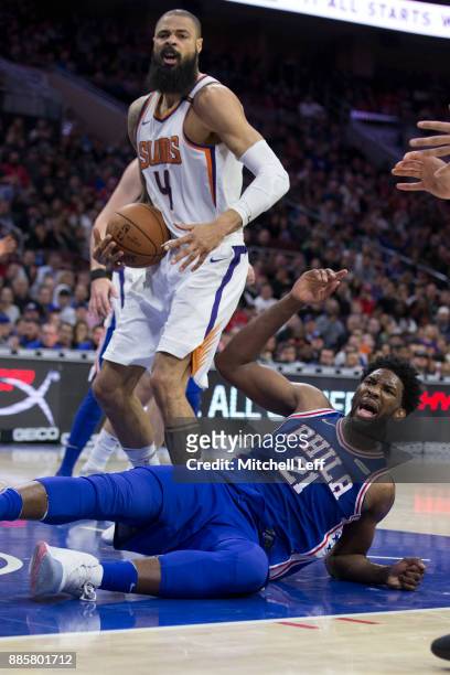 Joel Embiid of the Philadelphia 76ers reacts after being fouled by Tyson Chandler of the Phoenix Suns in the third quarter at the Wells Fargo Center...