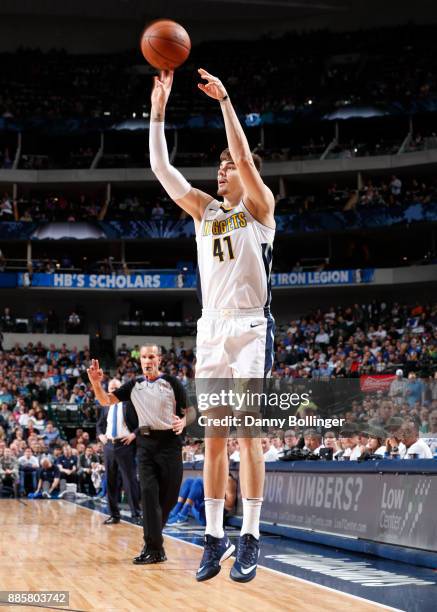 Juan Hernangomez of the Denver Nuggets shoots the ball against the Dallas Mavericks on December 4, 2017 at the American Airlines Center in Dallas,...