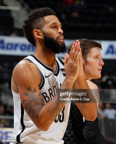 Allen Crabbe of the Brooklyn Nets reacts after hitting a three-point basket against Luke Babbitt of the Atlanta Hawks at Philips Arena on December 4,...