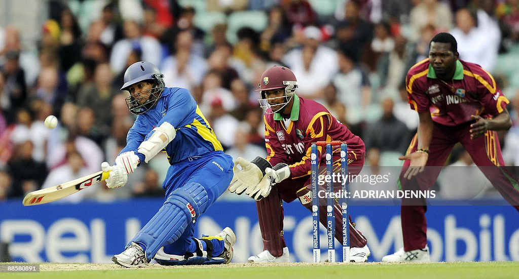 Sri Lanka's Dilshan (L) hits the ball fo