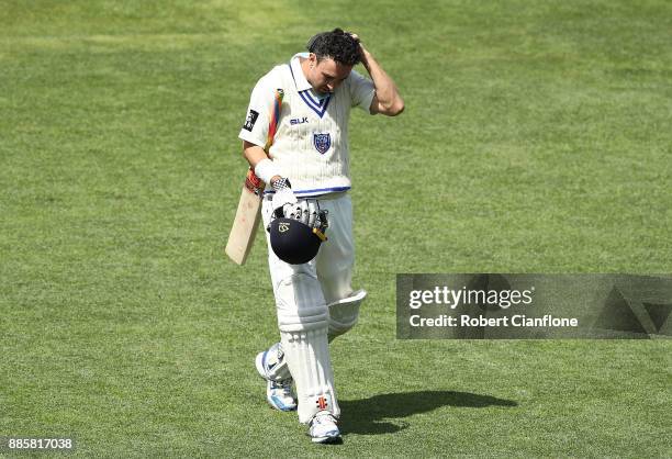 Ed Cowan of NSW walks off after he was dismissed during day three of the Sheffield Shield match between New South Wales and Tasmania at Blundstone...