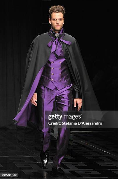 Model walks the runway during Carlo Pignatelli Cerimonia Fashion Show as part as Milan Fashion Week Menswear Spring/Summer 2010 on June 19, 2009 in...