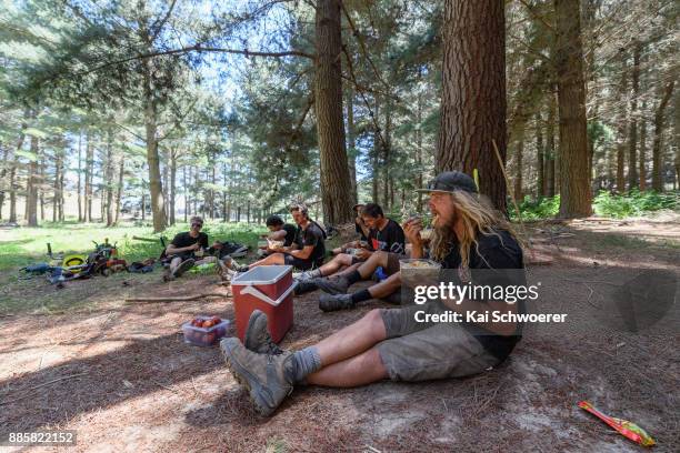 Trail supervisor Mike Armstrong and his team look on during a lunch break at Christchurch Adventure Park on December 5, 2017 in Christchurch, New...