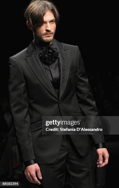 Model walks the runway during Carlo Pignatelli Cerimonia Fashion Show as part as Milan Fashion Week Menswear Spring/Summer 2010 on June 19, 2009 in...