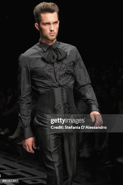 Model walks the runway during Carlo Pignatelli Cerimonia Fashion Show as part as Milan Fashion Week Menswear Spring/Summer 2010 on June 19, 2009 in...