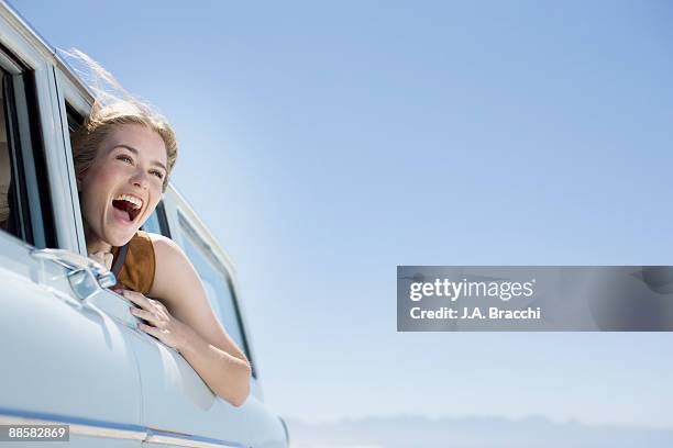 woman shouting out car window - air escaping stock pictures, royalty-free photos & images