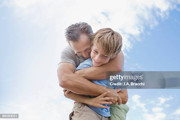 father hugging son - day 10 imagens e fotografias de stock