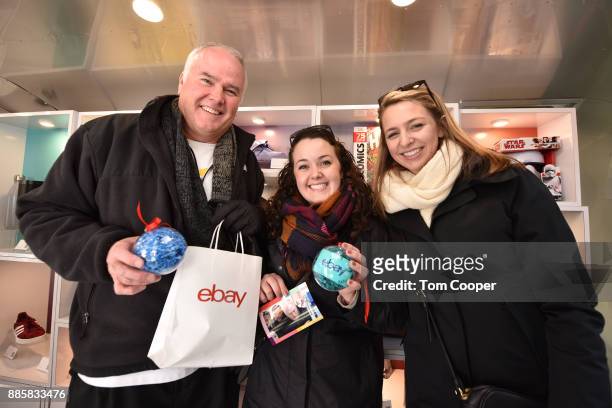 Patrick Cannan, Colleen Cannan, Julie Guerra of Buffalo, New York winning an set of Apple Airpods and a fifty dollar Ebay gift card on the Ebay claw...