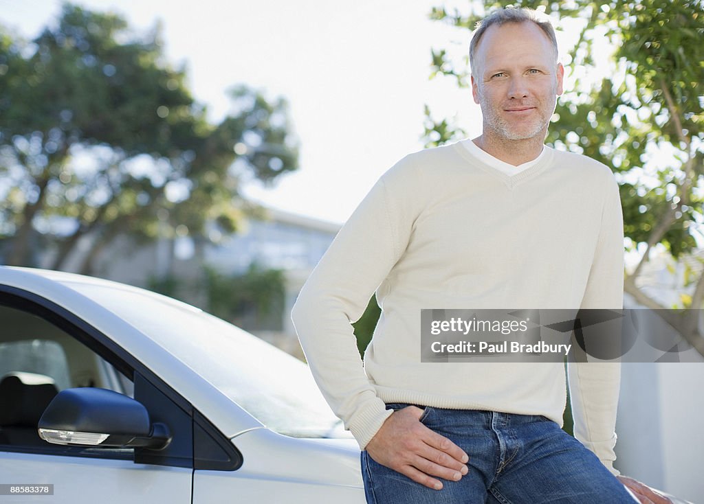 Man leaning on car