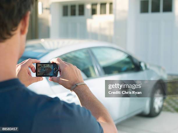 man photographing new car - car on driveway bildbanksfoton och bilder