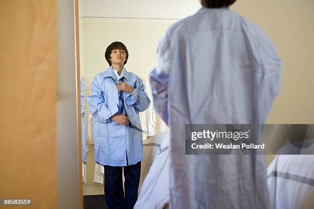 boy trying on fathers dress shirt - 特大 個照片及圖片檔