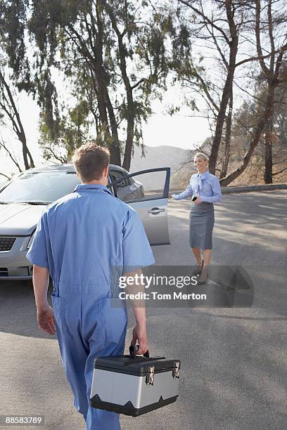 mechanic arriving to help stranded woman - car toolbox stock pictures, royalty-free photos & images