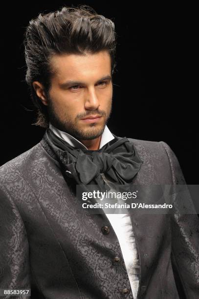 Model walks the runway during Carlo Pignatelli Cerimonia Fashion Show as part as Milan Fashion Week Menswear Spring/Summer 2010 on June 19, 2009 in...