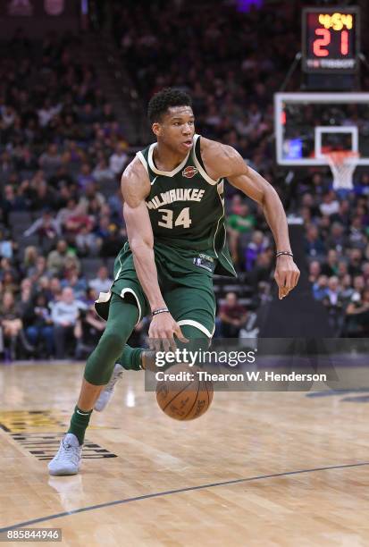 Giannis Antetokounmpo of the Milwaukee Bucks drives towards the basket with the ball against the Sacramento Kings during their NBA basketball game at...